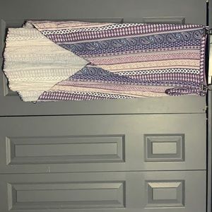 High low colorful printed Skirt with a tie on the side. Size: S A32